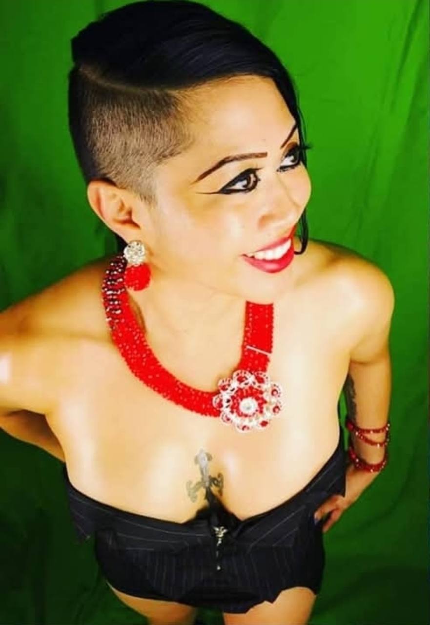 Kissa Allen, identified by Johnny, against a green backdrop