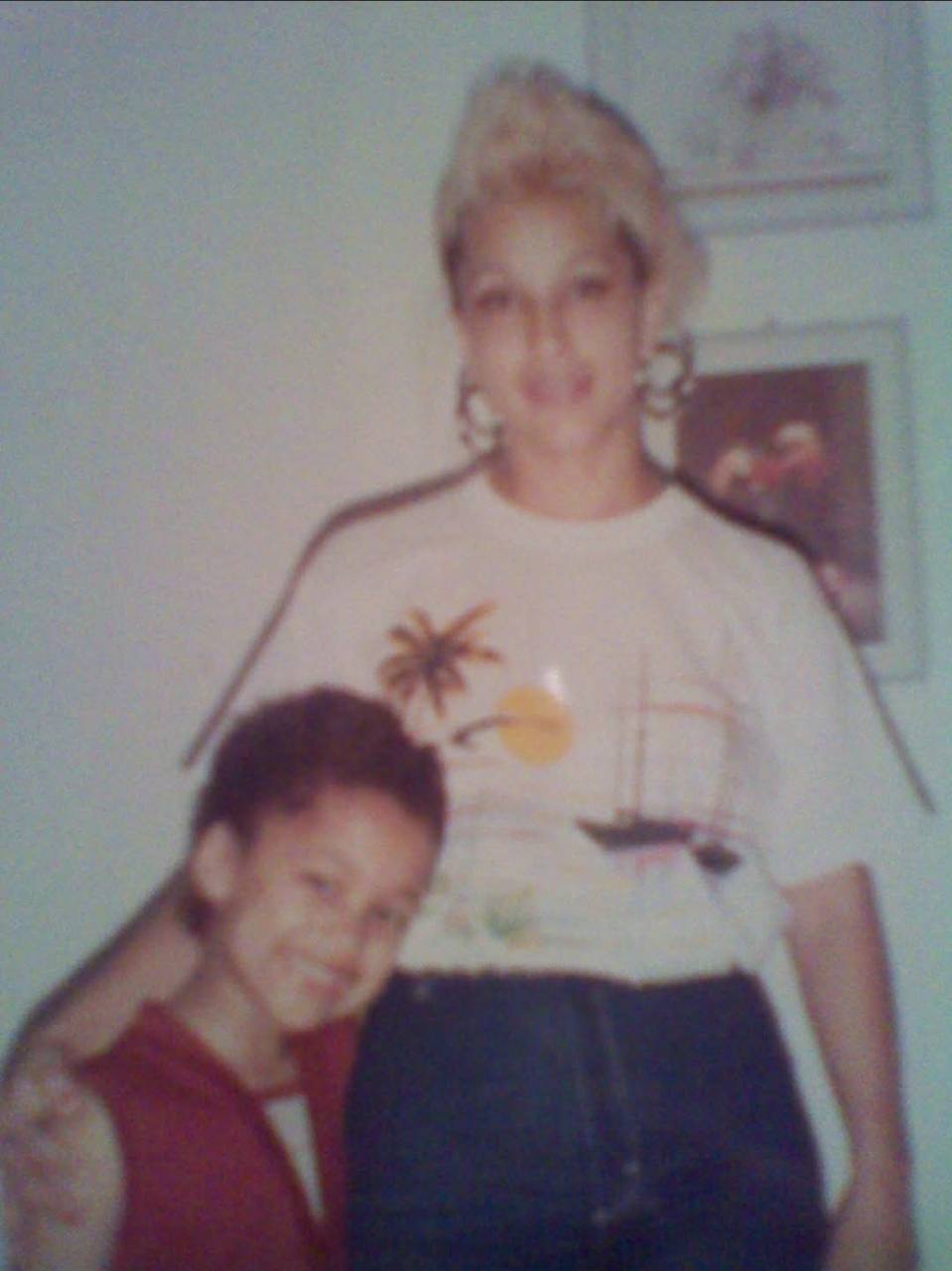 Maxine Allen in a white shirt with a child; Maxine identified by Johnny